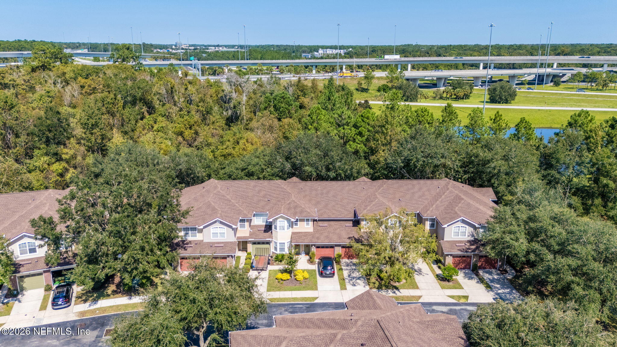 5663 Greenland Road, Unit 1201 Jacksonville, FL 32258 - Photo 63 of 82 an aerial view of a house with a lake view