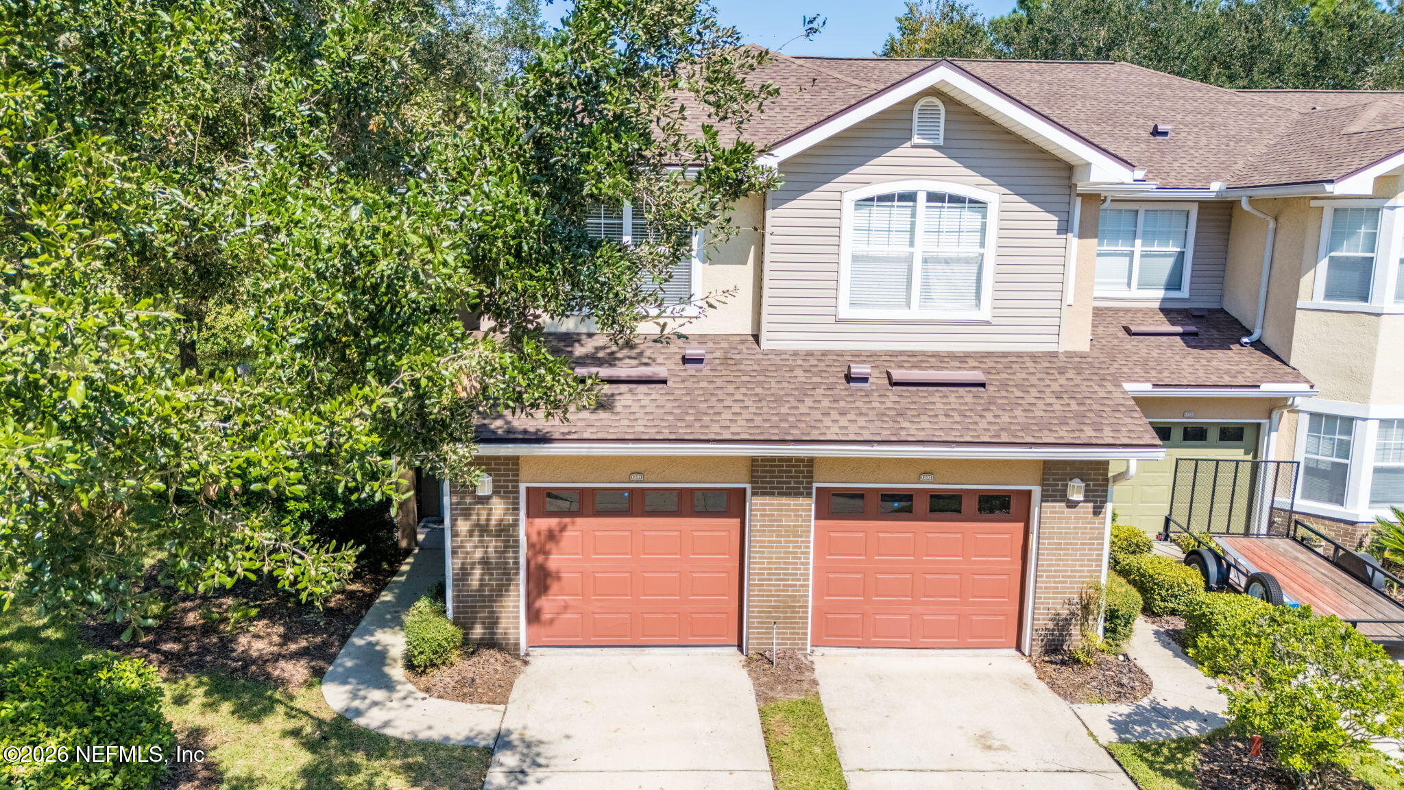 5663 Greenland Road, Unit 1201 Jacksonville, FL 32258 - Photo 65 of 82 a front view of a house with a garden