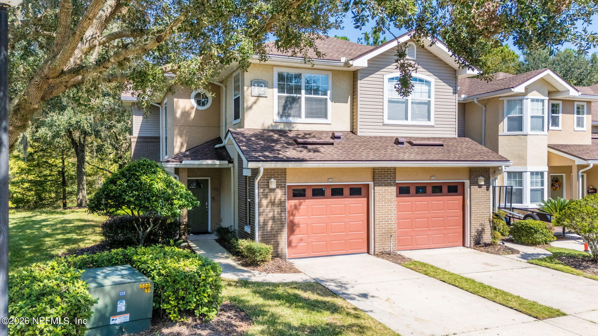 5663 Greenland Road, Unit 1201 Jacksonville, FL 32258 - Photo 67 of 82 a front view of a house with a yard