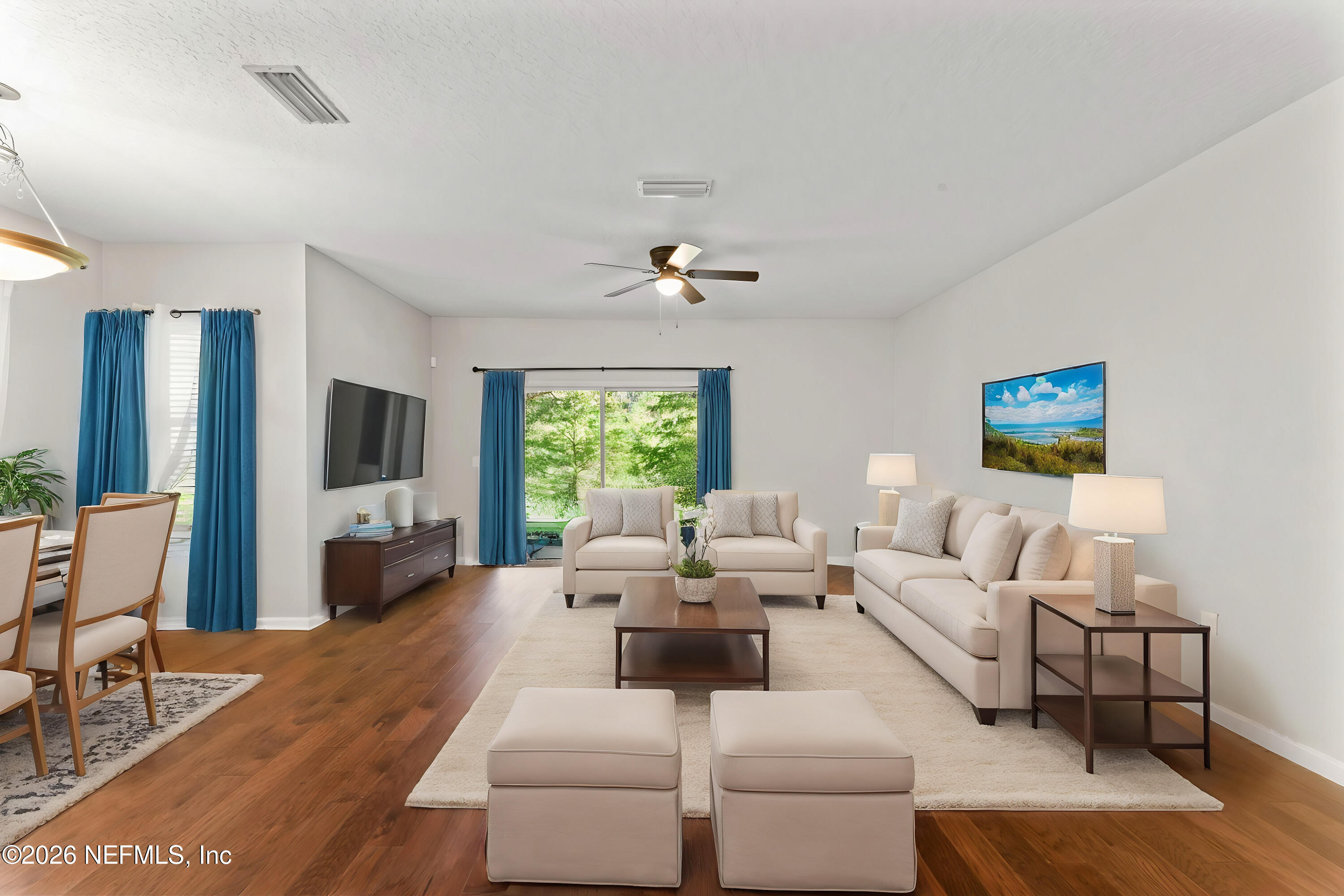 5663 Greenland Road, Unit 1201 Jacksonville, FL 32258 - Photo 79 of 82 a living room with furniture and a flat screen tv