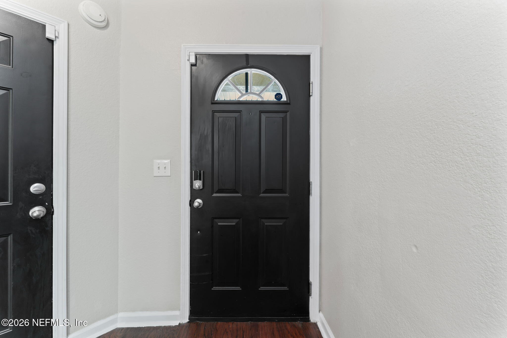 5663 Greenland Road, Unit 1201 Jacksonville, FL 32258 - Photo 8 of 82 a view of a hallway with wooden door