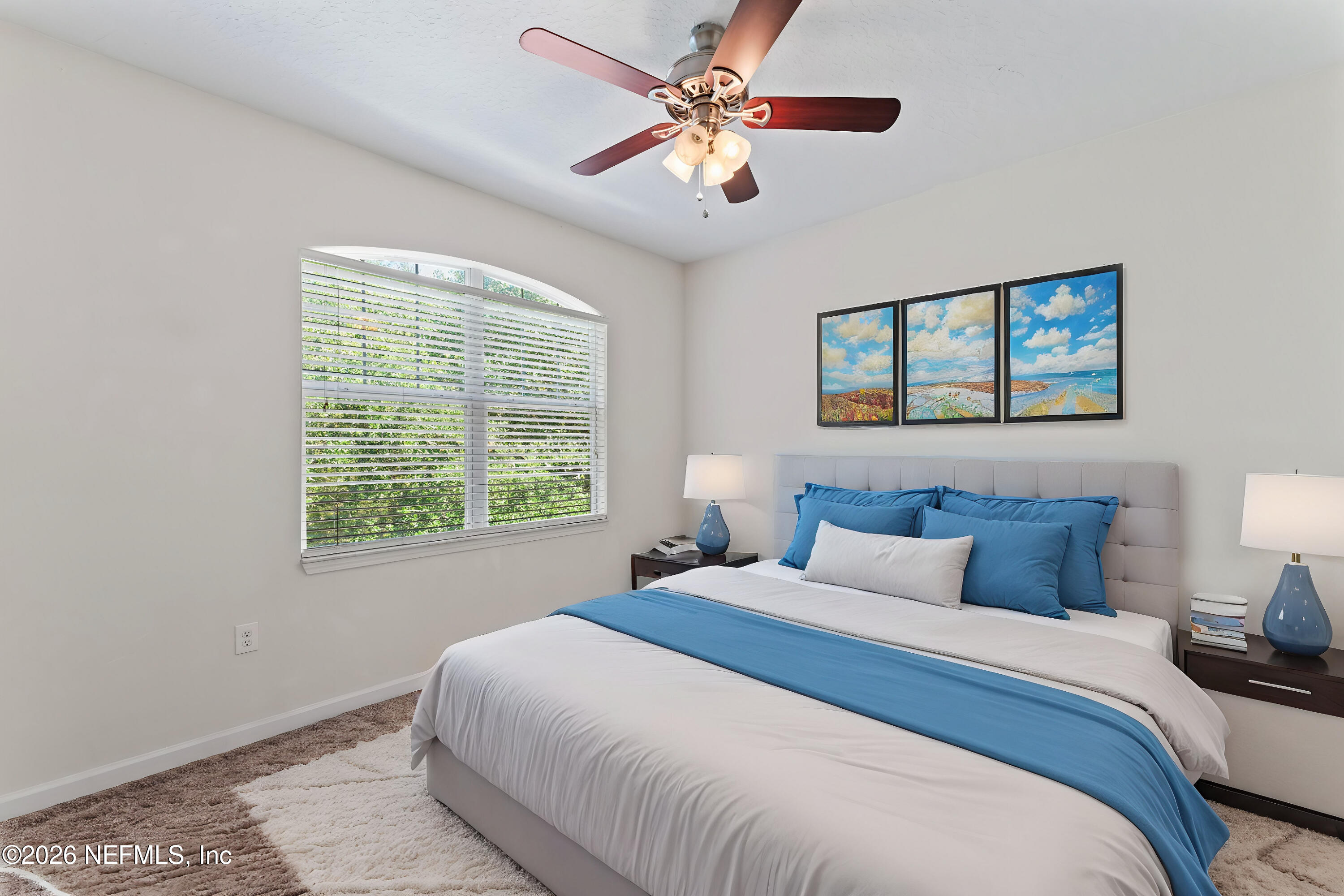 5663 Greenland Road, Unit 1201 Jacksonville, FL 32258 - Photo 81 of 82 a bedroom with a large bed and a window