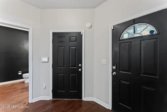 a kitchen with kitchen island granite countertop a sink stainless steel appliances and cabinets