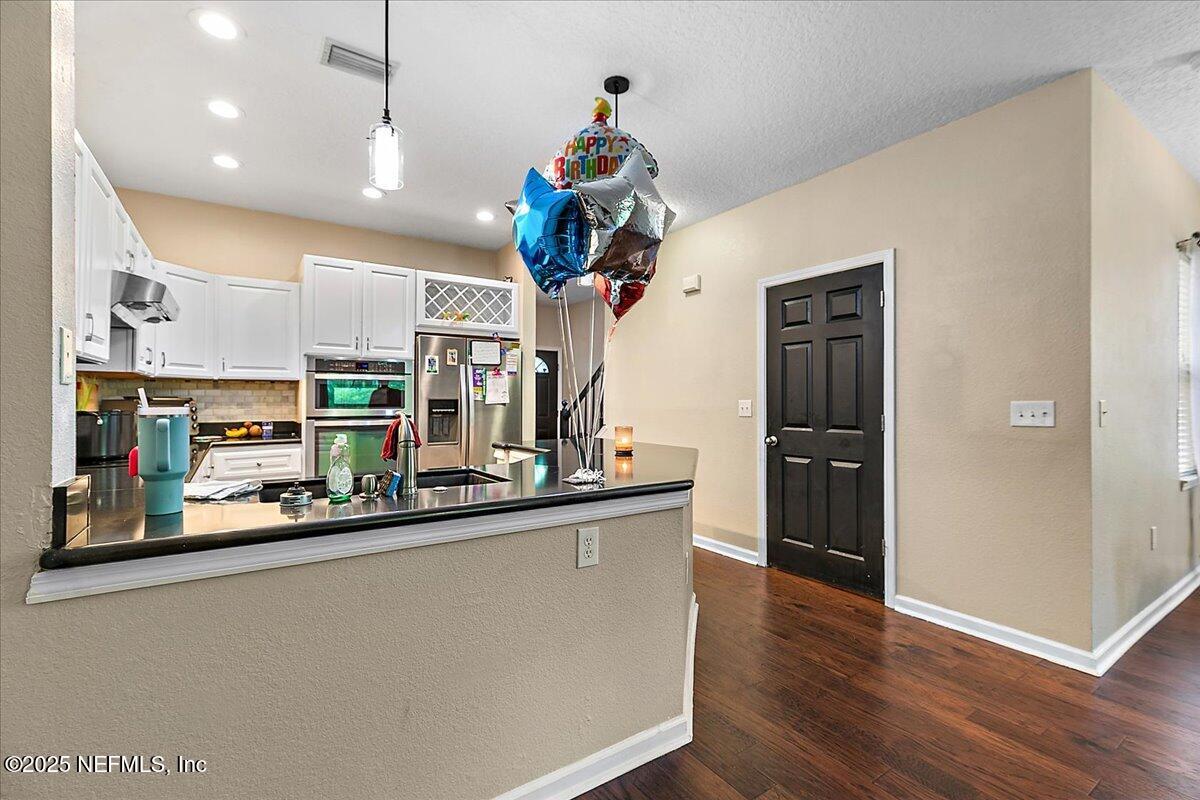 5663 Greenland Road, Unit 1201 Jacksonville, FL 32258 - Photo 9 of 18 a kitchen view of a counter space a sink and appliances