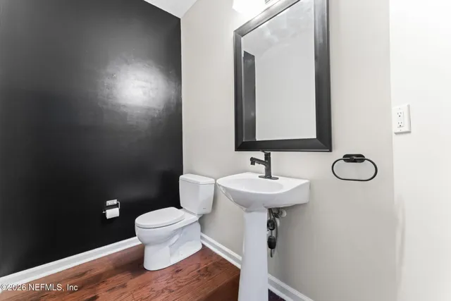 a kitchen with stainless steel appliances granite countertop white cabinets and a stove