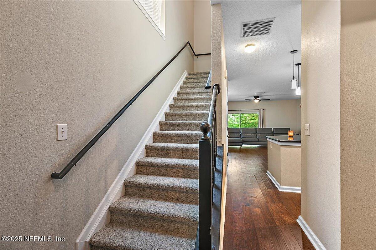 5663 Greenland Road, Unit 1201 Jacksonville, FL 32258 - Photo 10 of 18 a view of entryway and hall with wooden floor