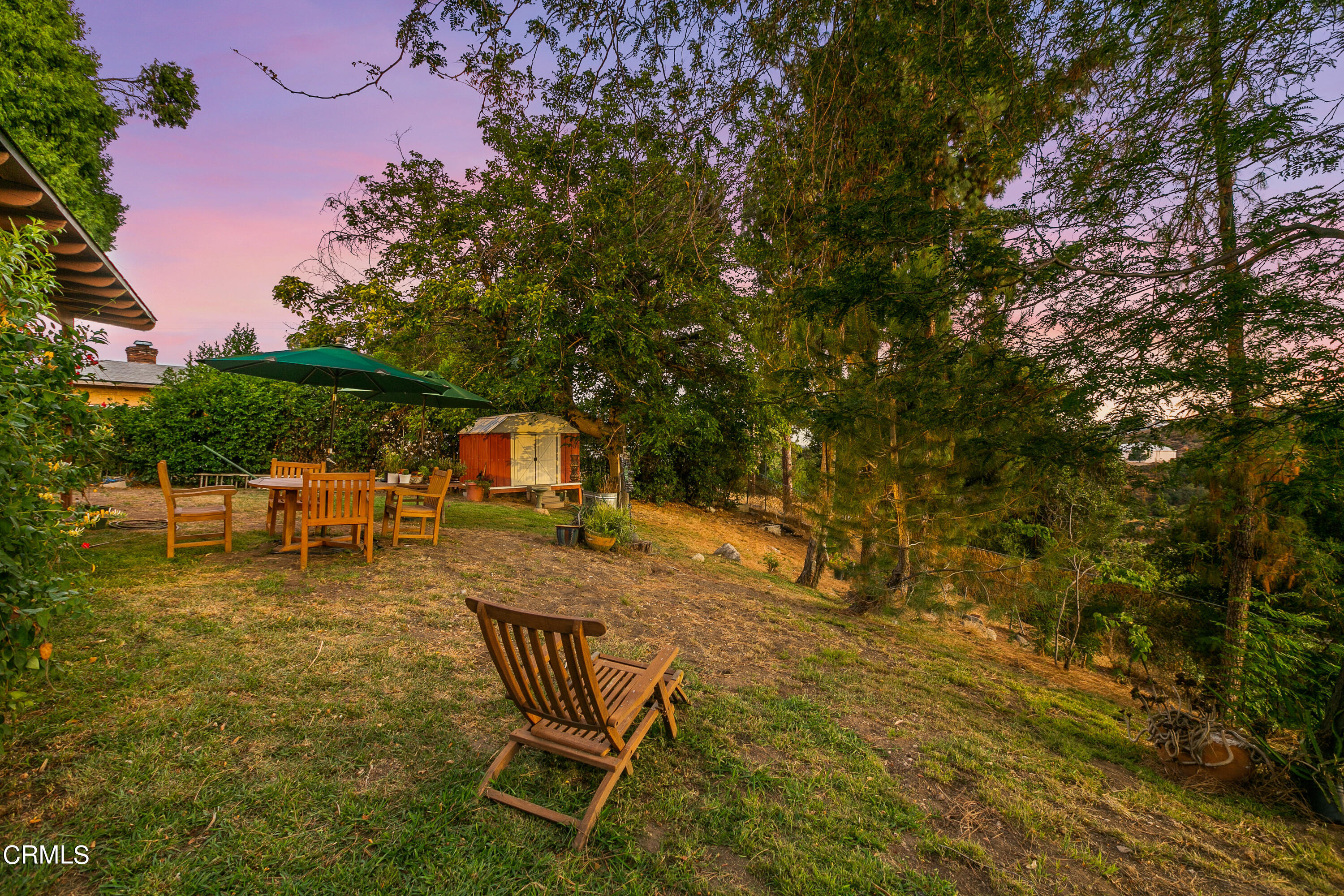 4131 Aralia Road Altadena, CA 91001 - Photo 17 of 19 a backyard of a house with table and chairs
