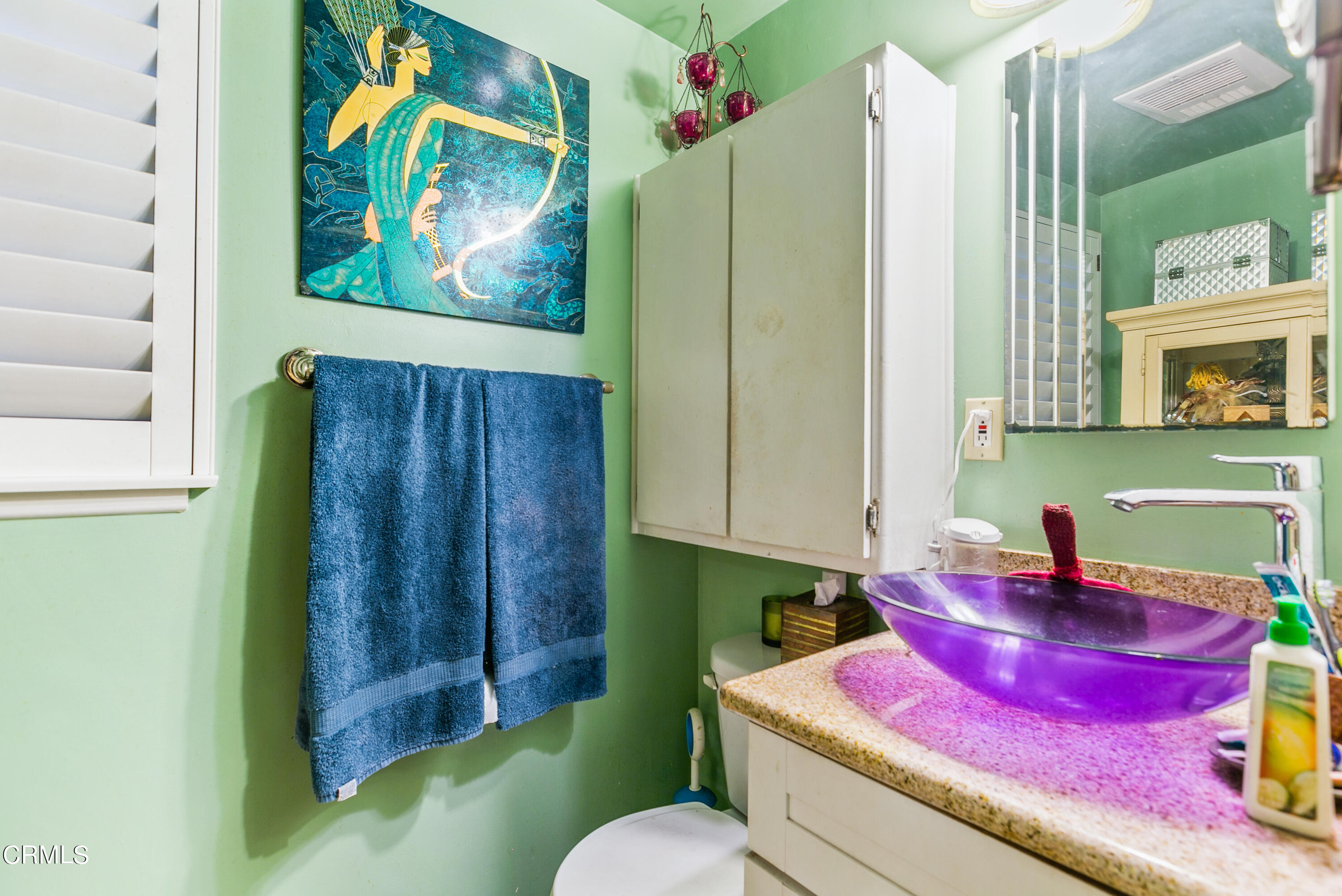 4131 Aralia Road Altadena, CA 91001 - Photo 9 of 19 a bathroom with a sink mirror and vanity