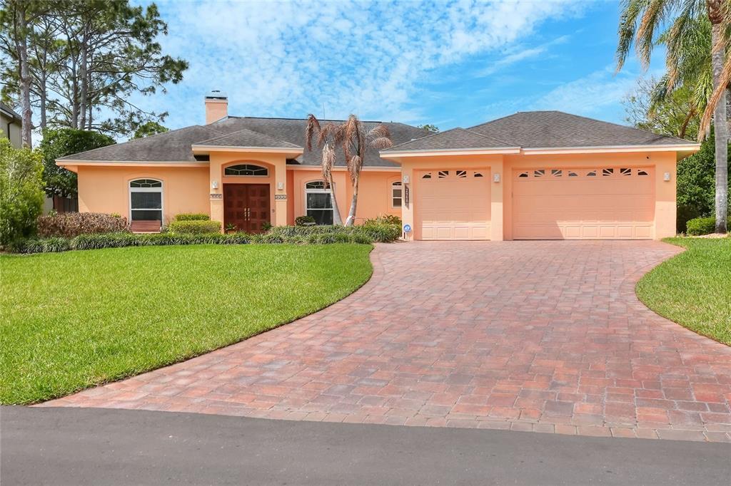 2968 Plantation Road Winter Haven, FL 33884 - Photo 6 of 81 a front view of a house with a yard and garage