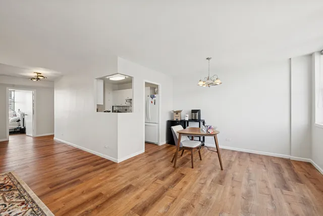 a workspace with furniture wooden floor and a rug