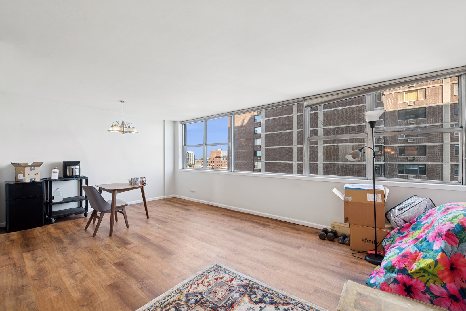 6301 North Sheridan Road, Unit 14E Chicago, IL 60660 - Photo 4 of 20 a living room with furniture and a window