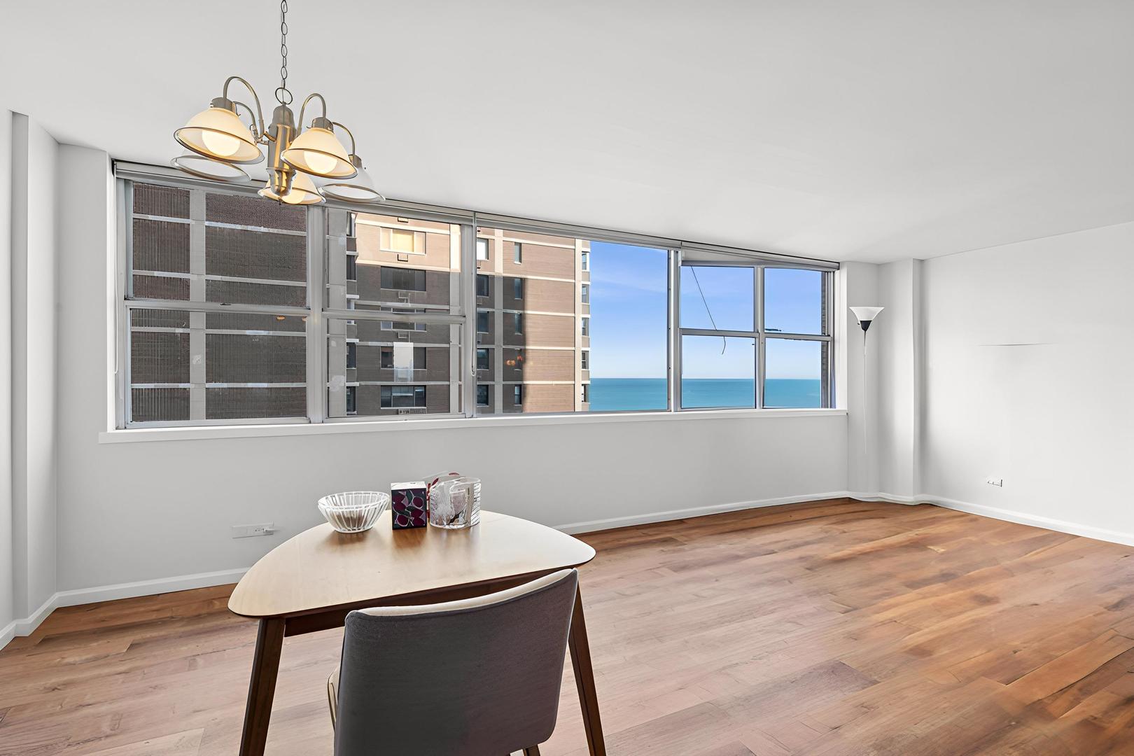 6301 North Sheridan Road, Unit 14E Chicago, IL 60660 - Photo 9 of 20 a workspace with furniture and window