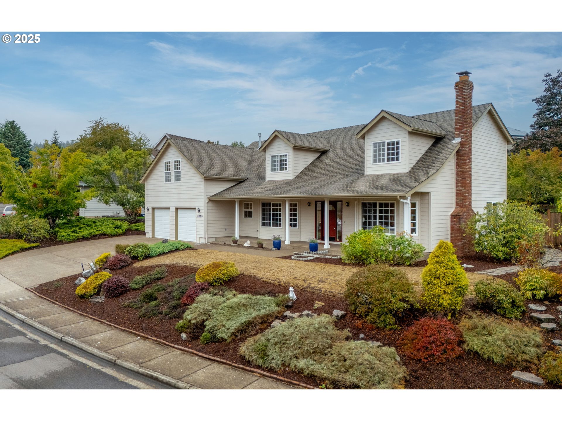 a front view of a house with garden