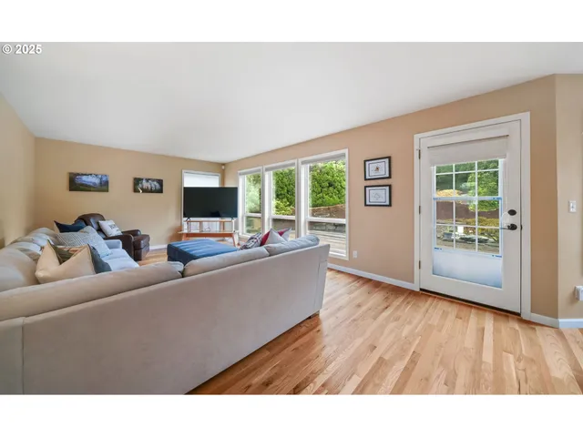 a view of a dining room with furniture and windows