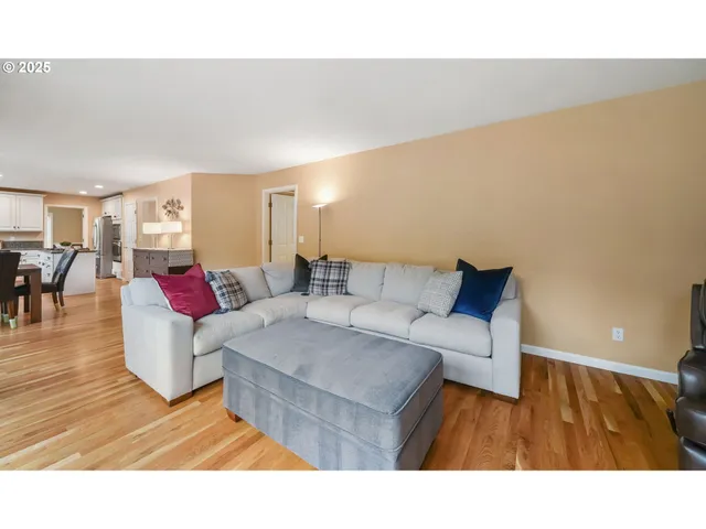 a picture of a floor to ceiling window and tree