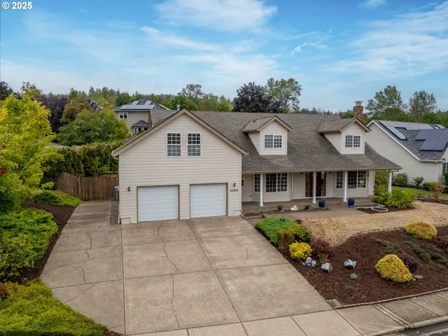 a front view of a house with garden