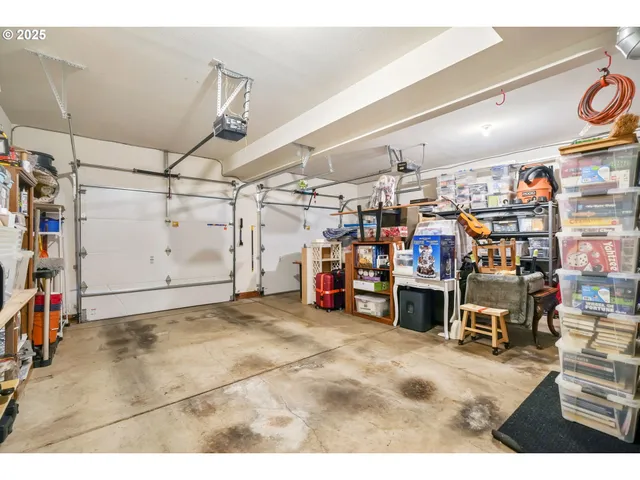 a kitchen with stainless steel appliances granite countertop a stove a sink dishwasher and cabinets with wooden floor