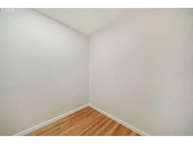 a picture of a living room with a large window