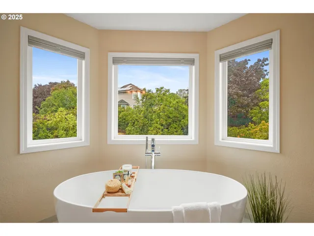 a bathroom with a granite countertop sink mirror and a toilet