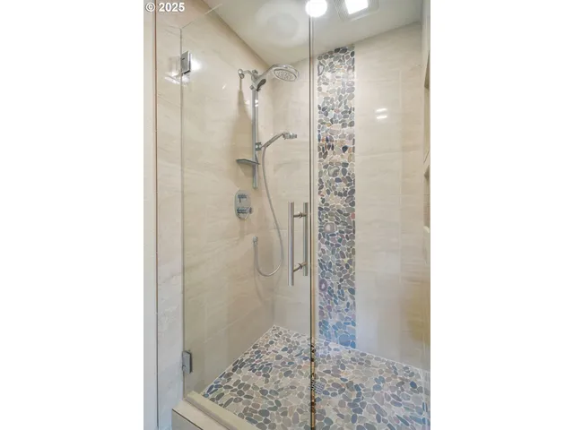 a bathroom with a bathtub and a shower