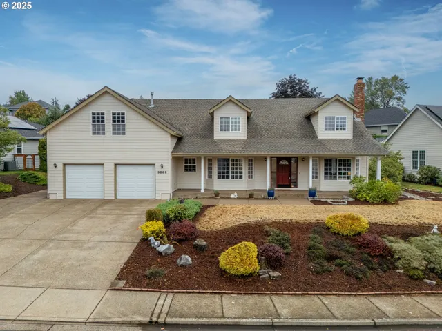 a front view of a house with garden