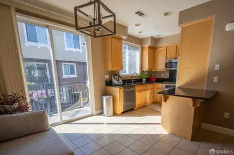 a kitchen with a stove a sink and a microwave