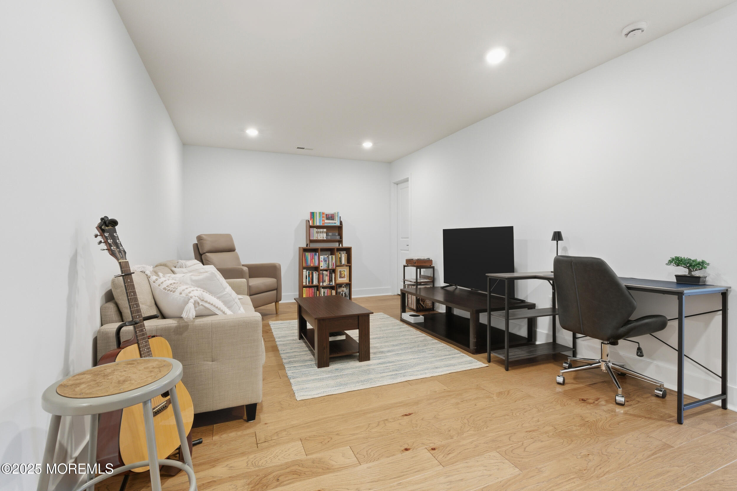 130 Woolley Court Oakhurst, NJ 07712 - Photo 16 of 34 a view of a livingroom with workspace and a couch