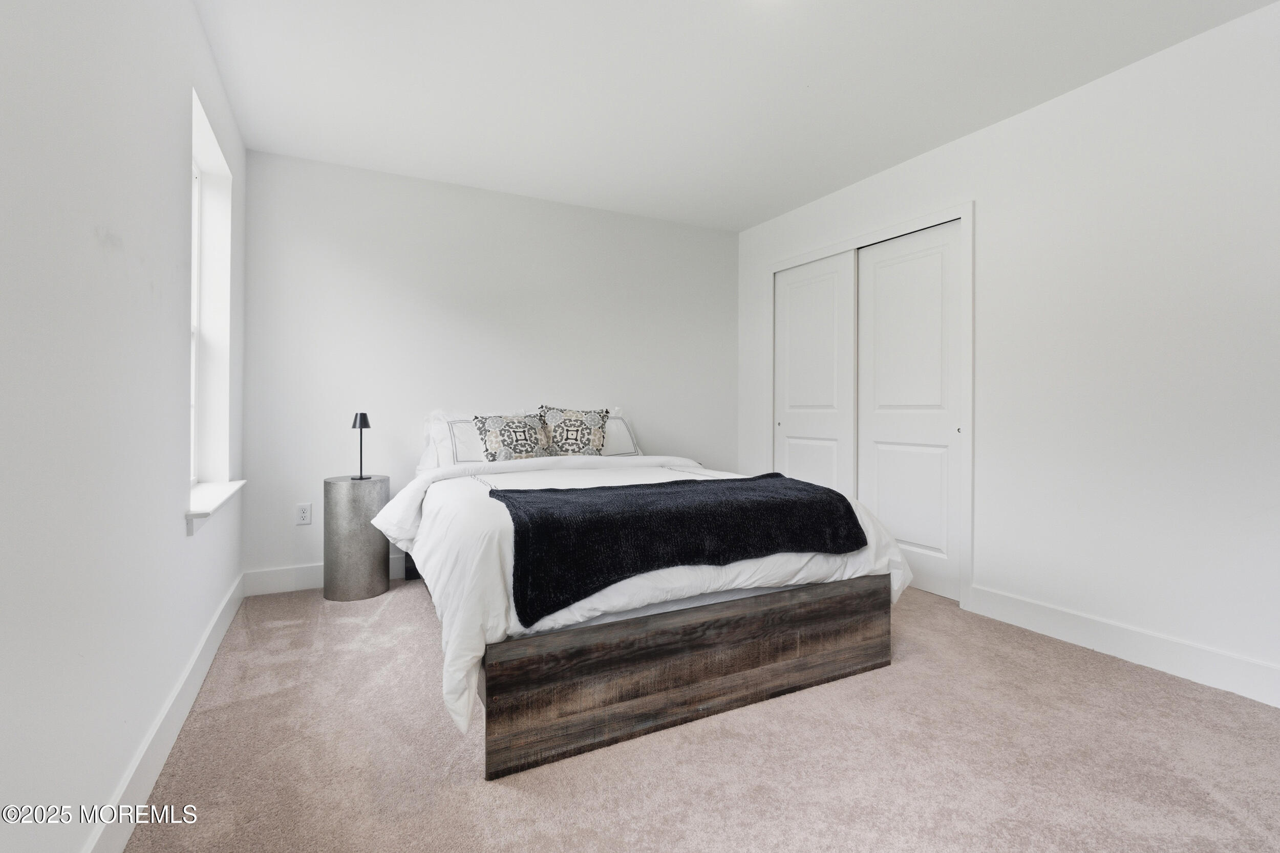 130 Woolley Court Oakhurst, NJ 07712 - Photo 18 of 34 a bedroom with a bed and a window