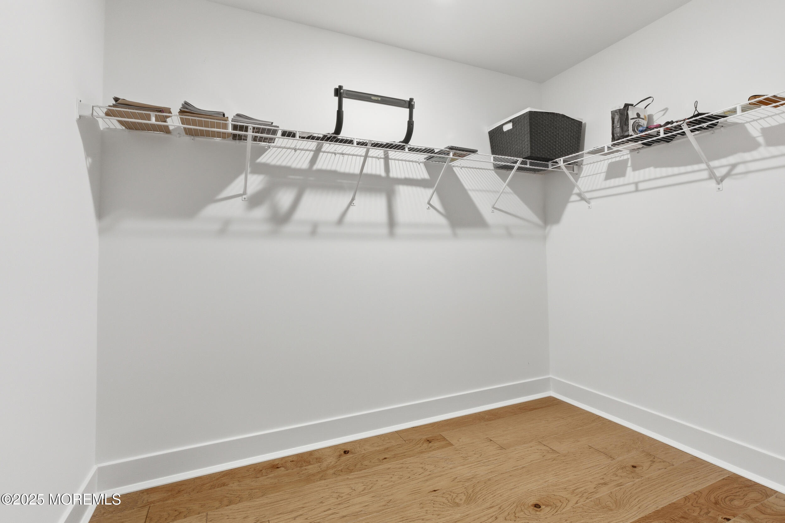 130 Woolley Court Oakhurst, NJ 07712 - Photo 24 of 34 a view of a room with racks on the wall