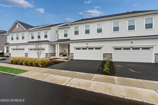 a front view of a house with yard