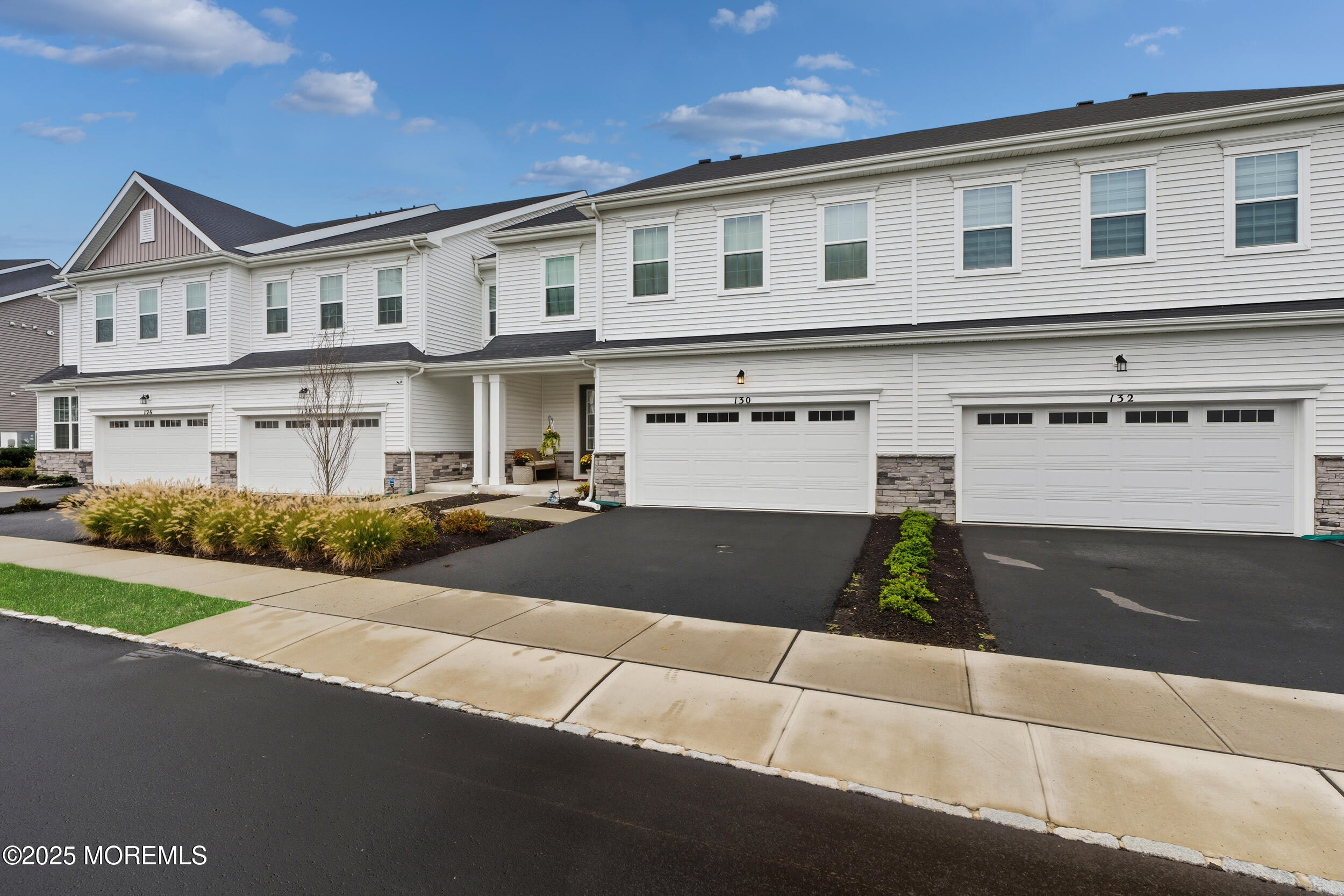 130 Woolley Court Oakhurst, NJ 07712 - Photo 32 of 34 a front view of a house with yard