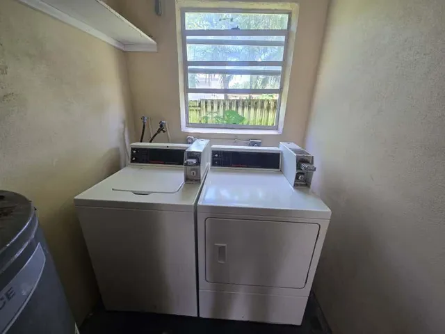 a bathroom with a toilet mirror and sink