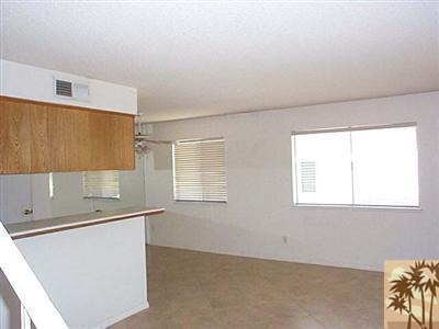 72685 Raven Road, Unit 3 Palm Desert, CA 92260 - Photo 4 of 8 an empty room with a window