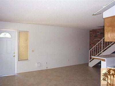 72685 Raven Road, Unit 3 Palm Desert, CA 92260 - Photo 5 of 8 an empty room with windows