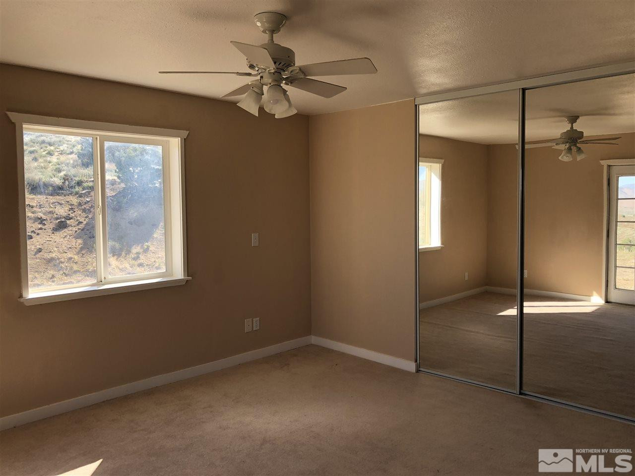 2850 Alexander Road Reno, NV 89510 - Photo 9 of 22 a view of an empty room with a window