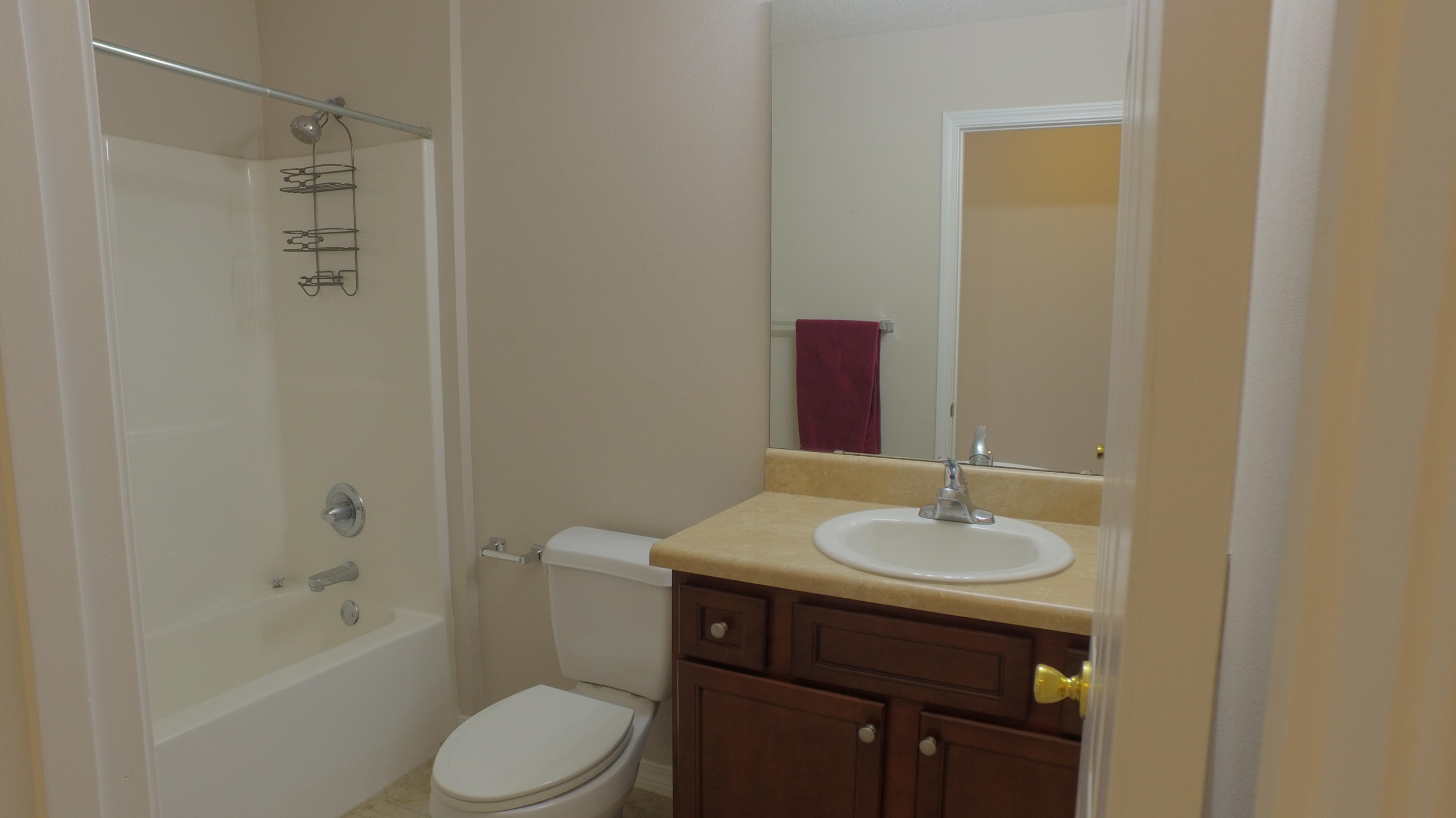 303 Dahlquist Drive Crestview, FL 32539 - Photo 14 of 15 a bathroom with a sink toilet and shower