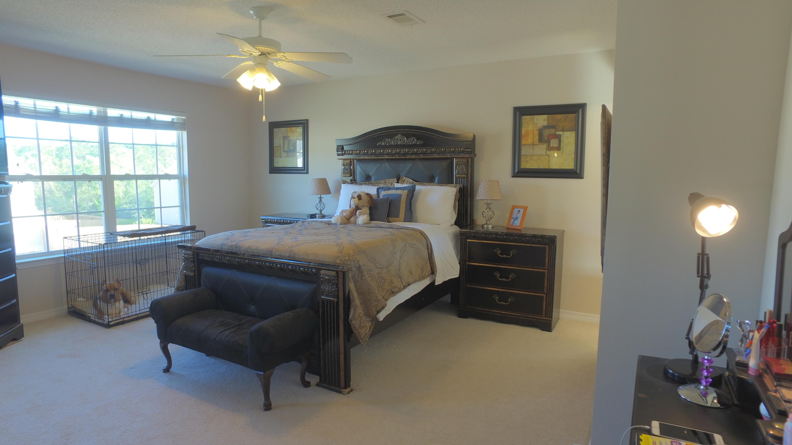 303 Dahlquist Drive Crestview, FL 32539 - Photo 7 of 15 a bedroom with a bed and a chandelier