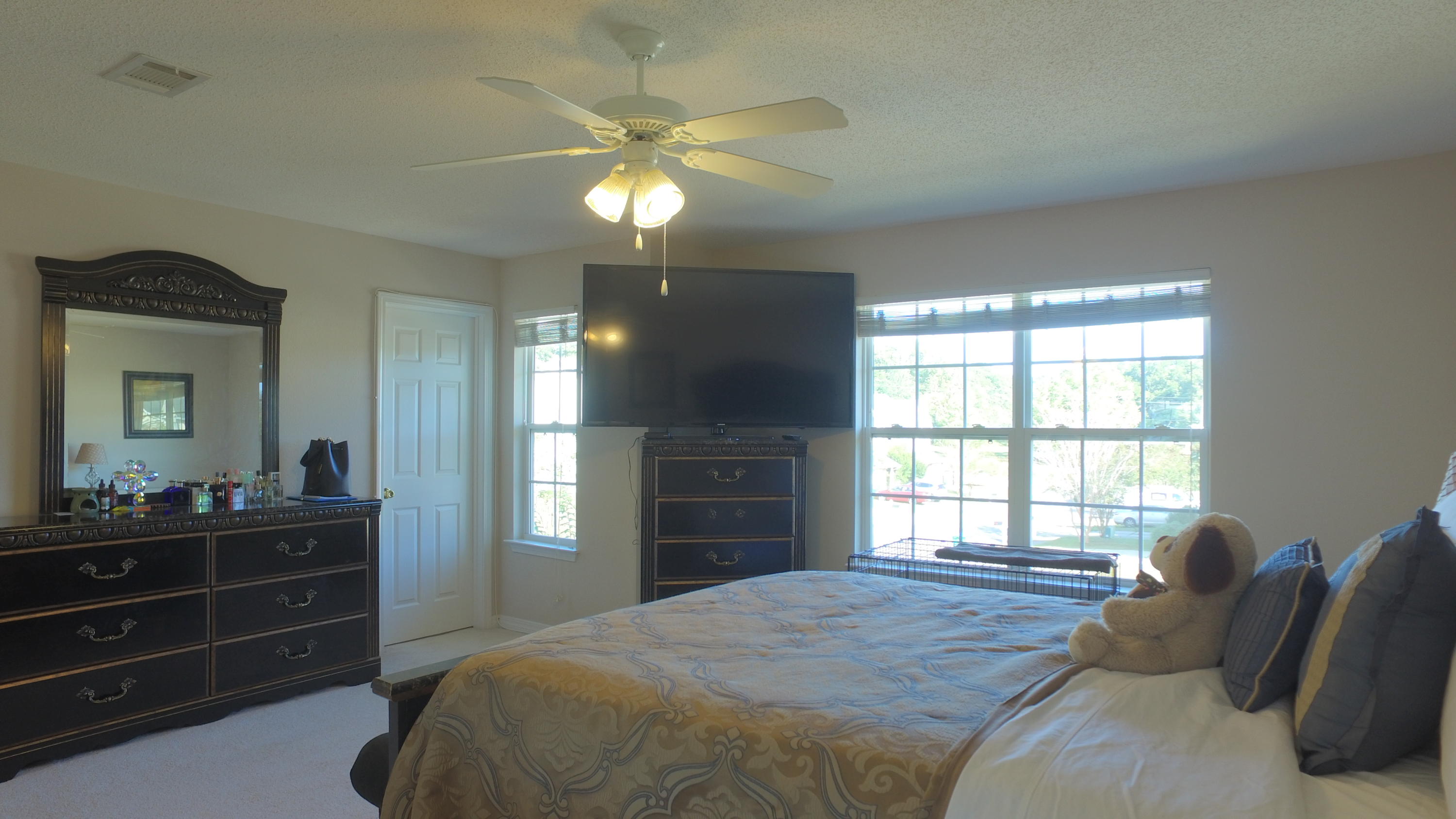 303 Dahlquist Drive Crestview, FL 32539 - Photo 8 of 15 a bedroom with a bed and a dresser with mirror