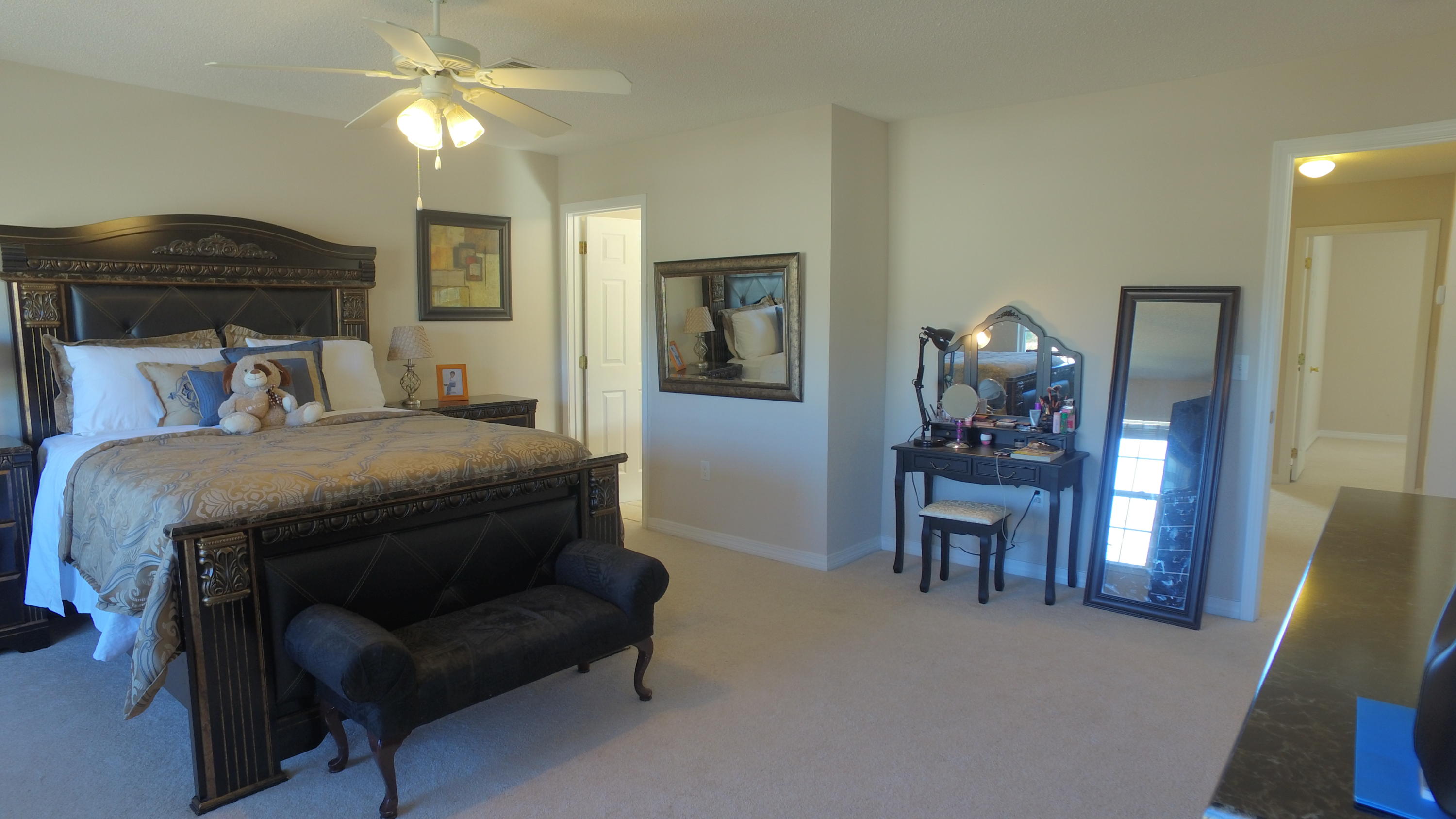 303 Dahlquist Drive Crestview, FL 32539 - Photo 9 of 15 a bedroom with a bed and a chandelier