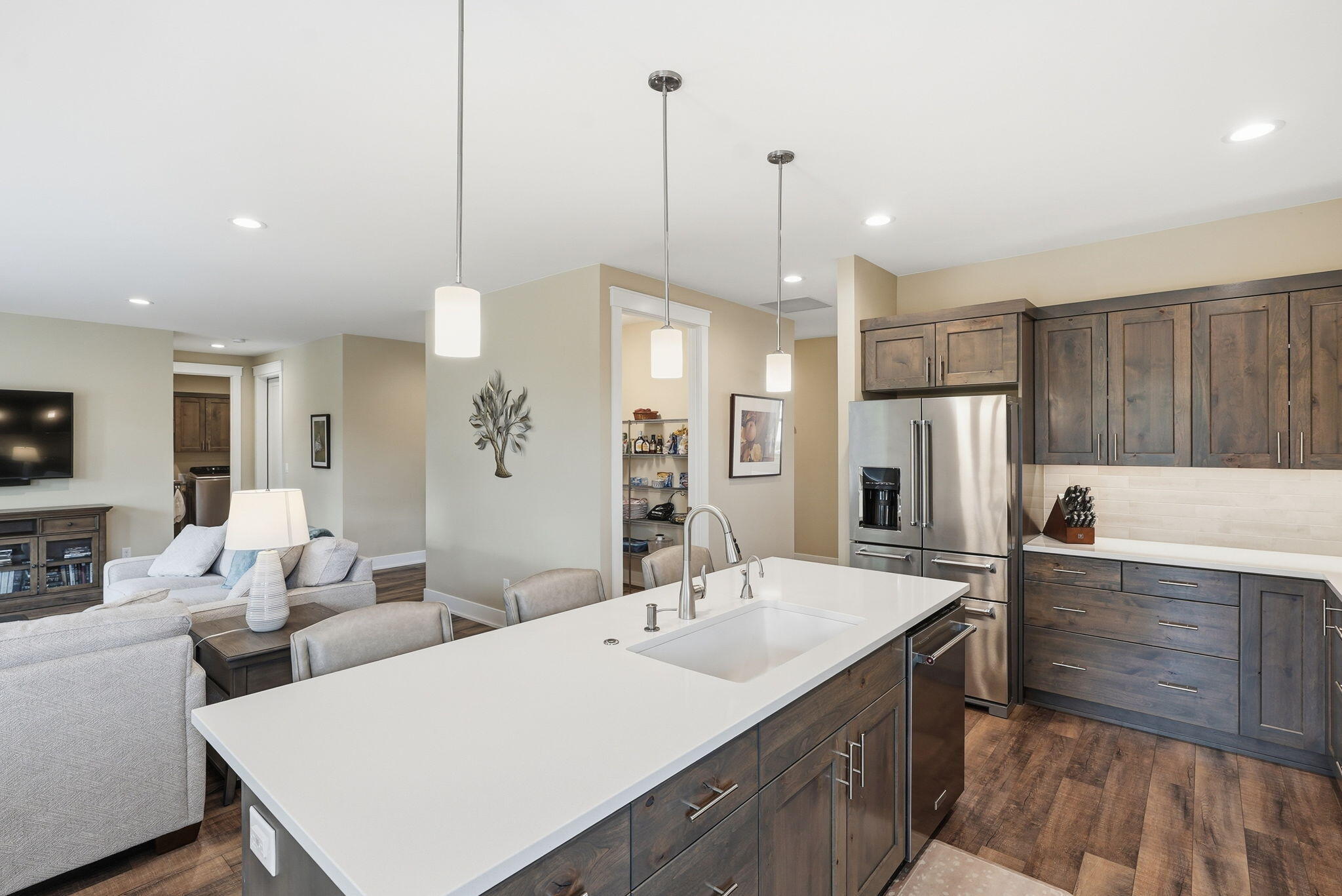 2714 Northwest 23rd Street Redmond, OR 97756 - Photo 15 of 57 a kitchen with stainless steel appliances kitchen island granite countertop a sink a refrigerator and a stove