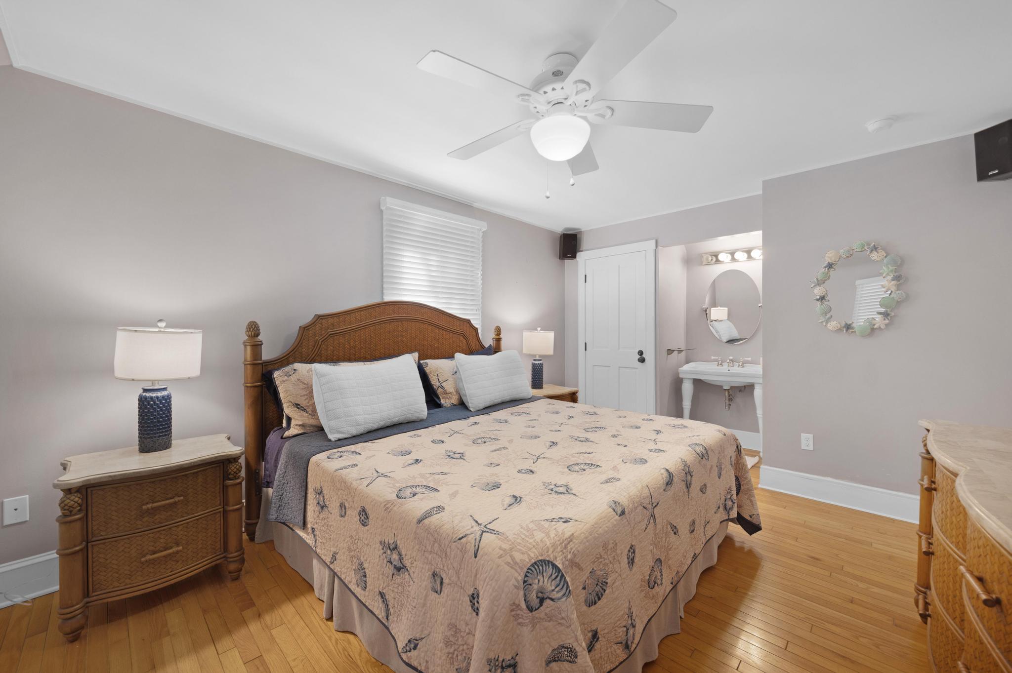 606 Truman Avenue, Unit 10 Key West, FL 33040 - Photo 11 of 20 a bedroom with a bed and a chandelier