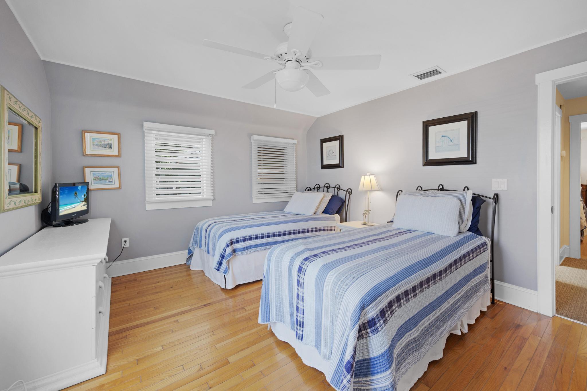 606 Truman Avenue, Unit 10 Key West, FL 33040 - Photo 16 of 20 a bedroom with a bed and a flat screen tv