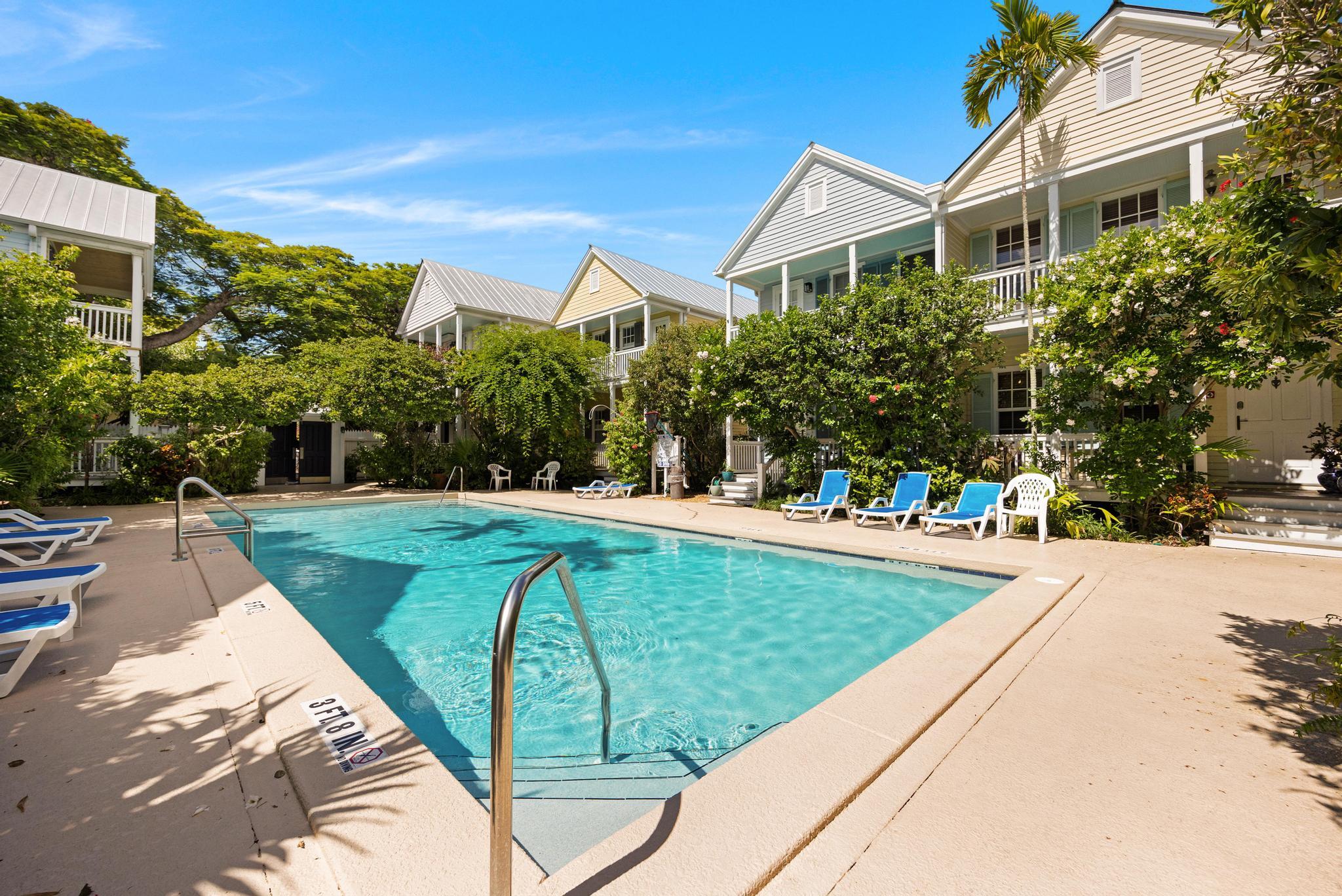 606 Truman Avenue, Unit 10 Key West, FL 33040 - Photo 18 of 20 a view of a house with a yard
