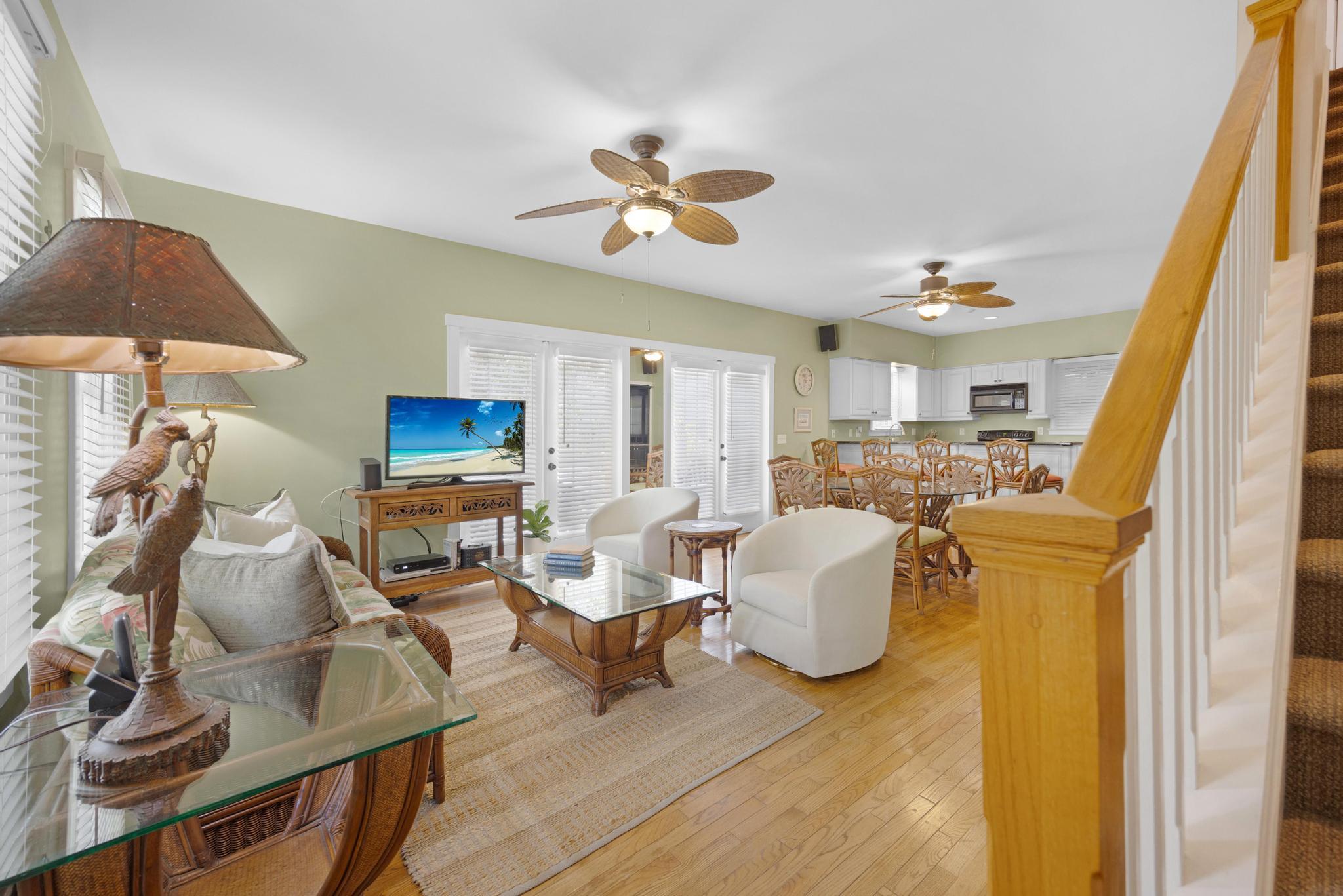 606 Truman Avenue, Unit 10 Key West, FL 33040 - Photo 3 of 20 a living room with furniture and a flat screen tv