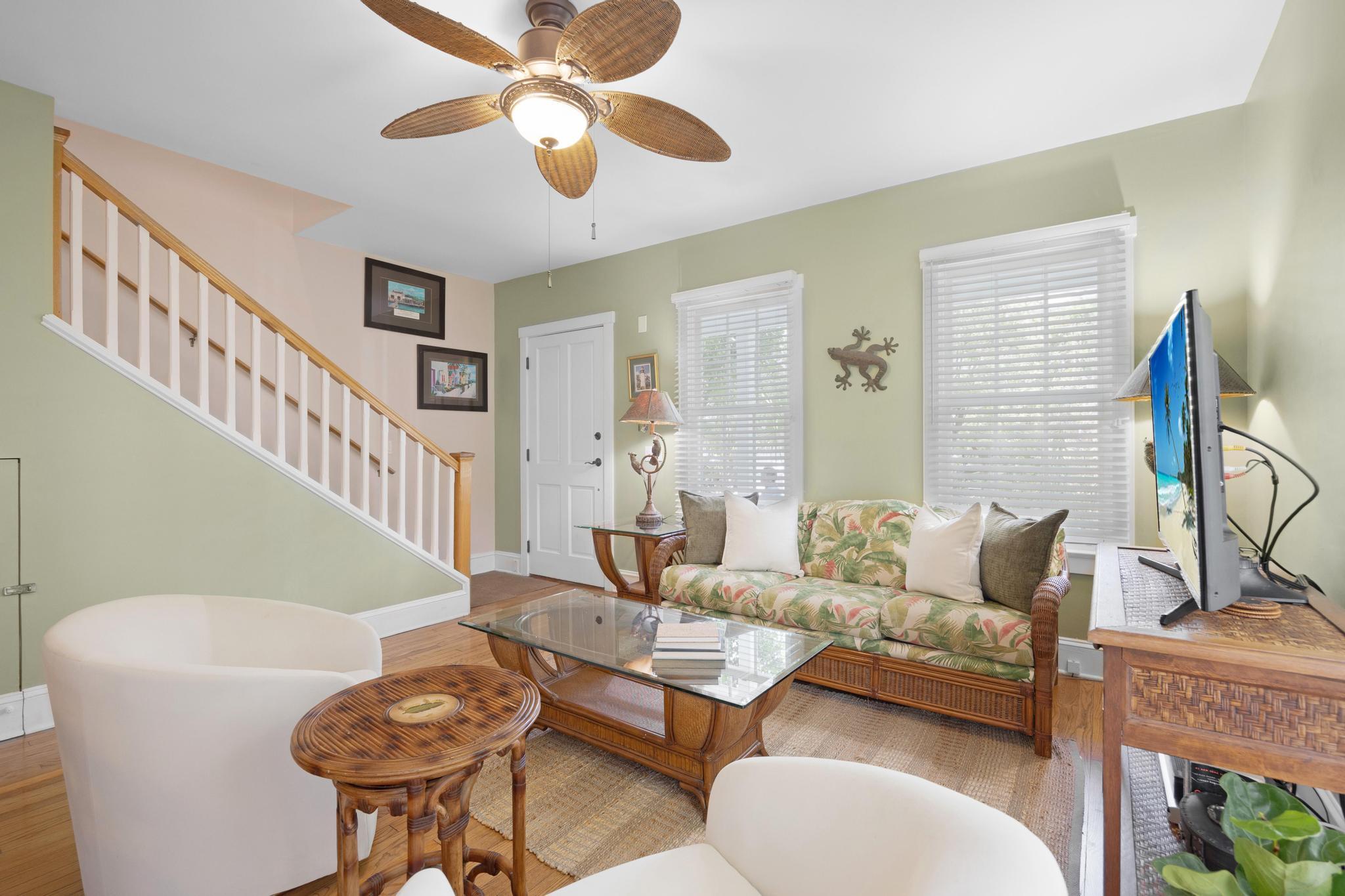 606 Truman Avenue, Unit 10 Key West, FL 33040 - Photo 4 of 20 a living room with furniture and a chandelier