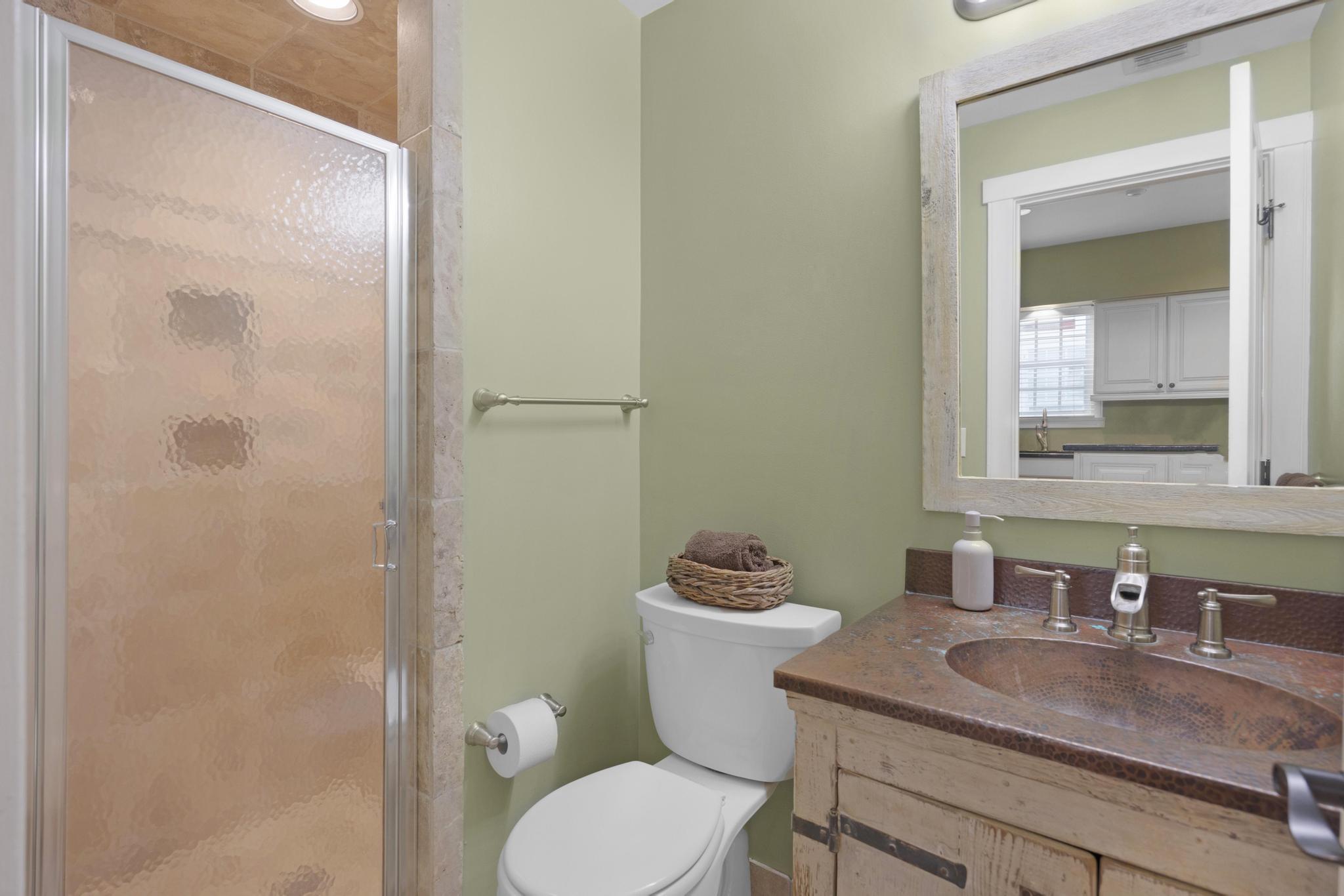 606 Truman Avenue, Unit 10 Key West, FL 33040 - Photo 8 of 20 a bathroom with a granite countertop toilet a sink and a mirror