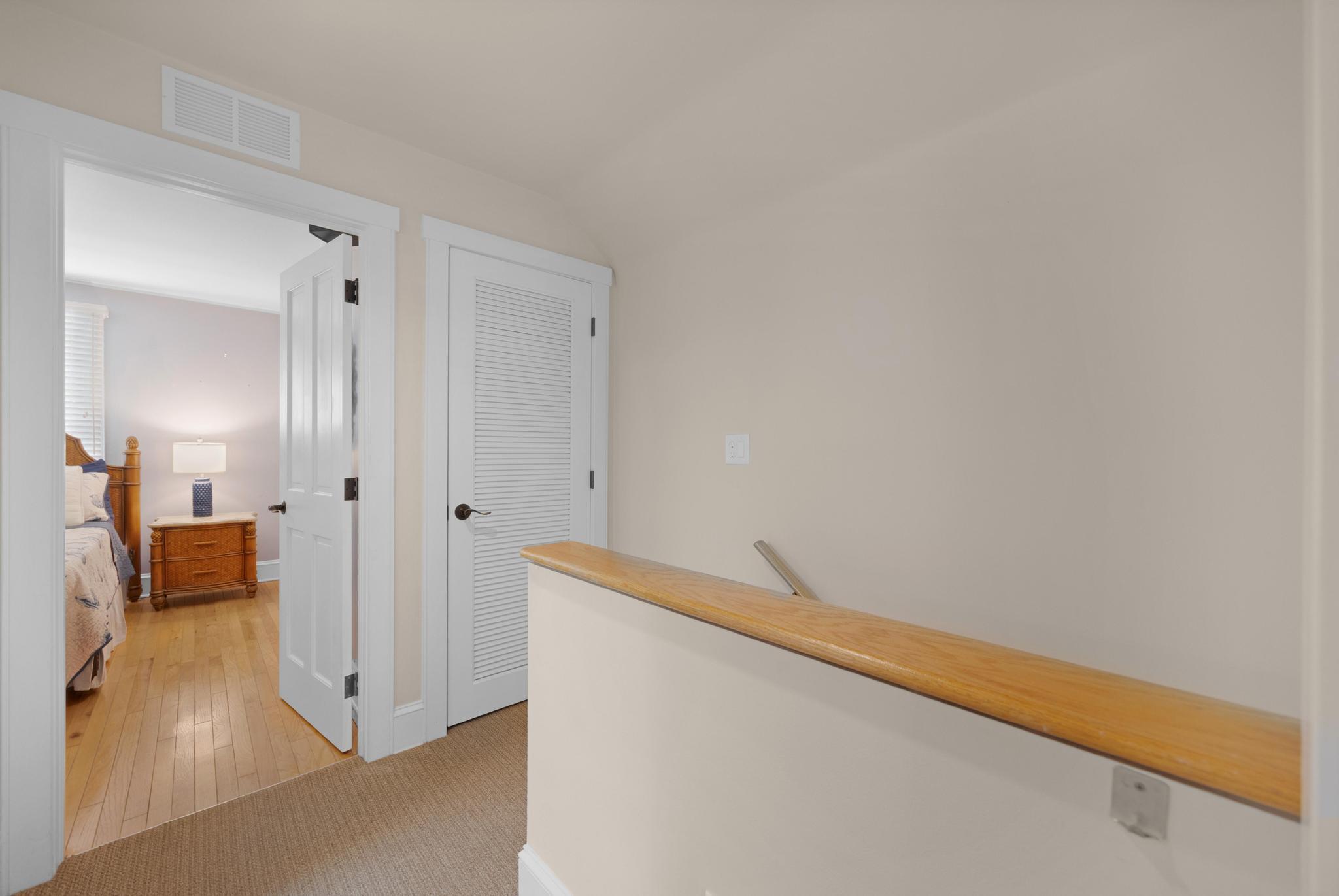 606 Truman Avenue, Unit 10 Key West, FL 33040 - Photo 10 of 20 a view of a hallway with wooden floor