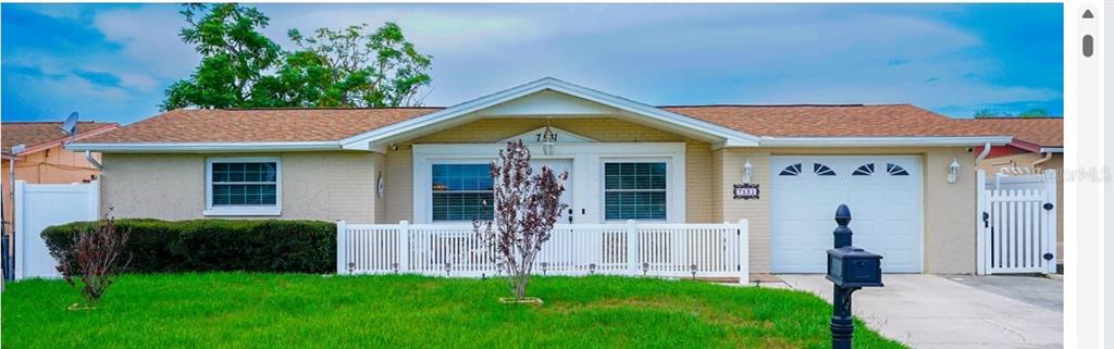 7531 Kensico Drive Port Richey, FL 34668 - Photo 1 of 1 front view of a house with a yard