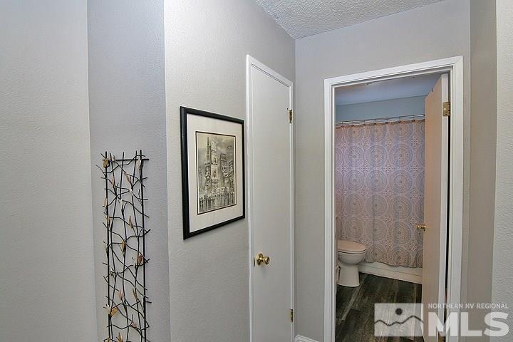 4985 West 7th Street, Unit 10 Reno, NV 89503 - Photo 14 of 20 a view of bathroom with a walk in closet and mirror