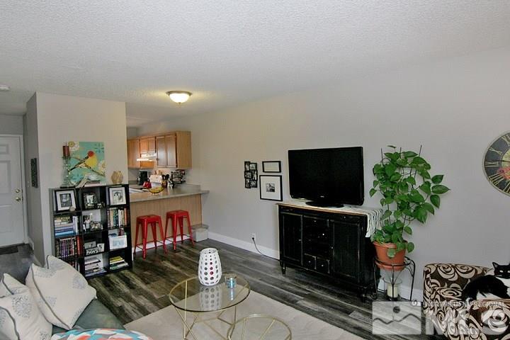 4985 West 7th Street, Unit 10 Reno, NV 89503 - Photo 6 of 20 a living room with furniture and a flat screen tv
